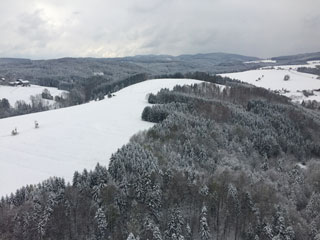 Mountains in the snow while helicopter flight to Salzburg, Austia