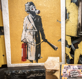 Banksy Mural Woman with a Gas Mask is now on display in Kyiv-Pechersk Lavra